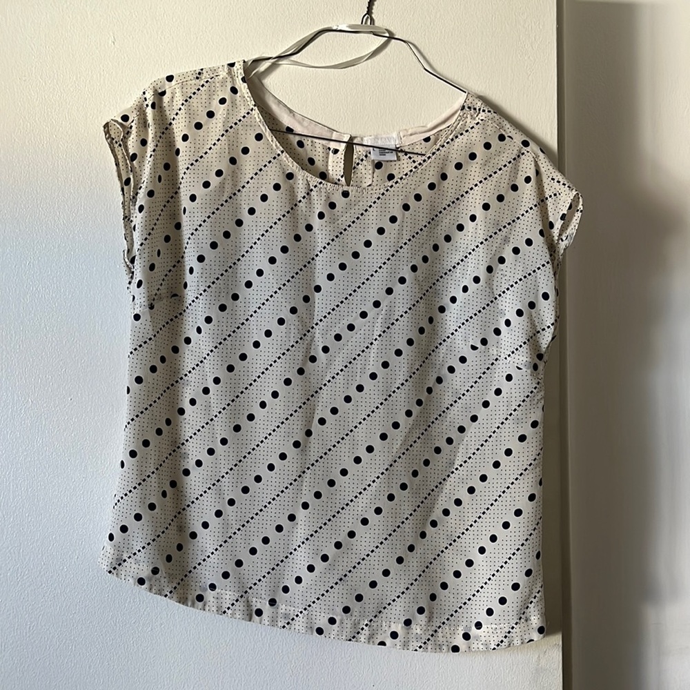 Cooperative White and navy polka dot blouse.